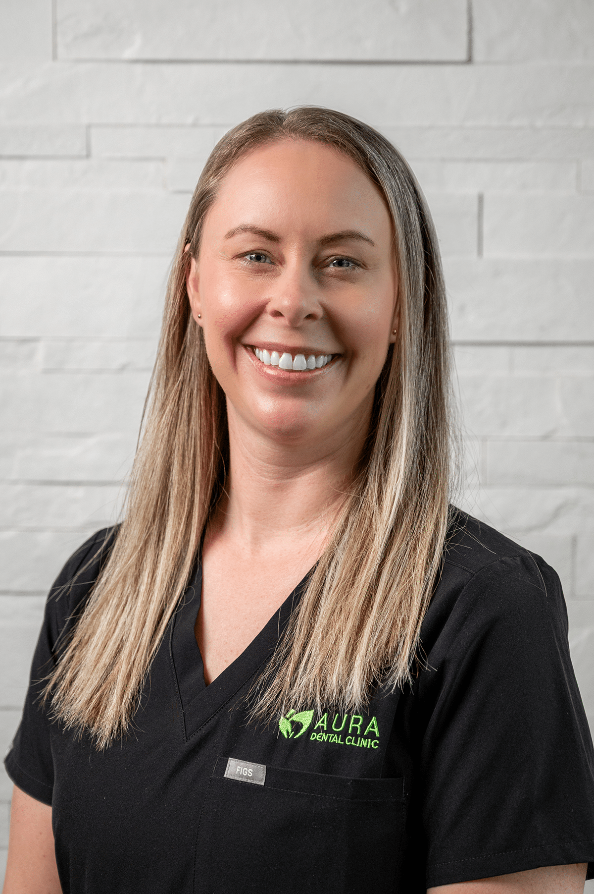 A woman wearing a black shirt and green shirt stands in front of Aura Dental Clinic, labeled 'Britanny'.