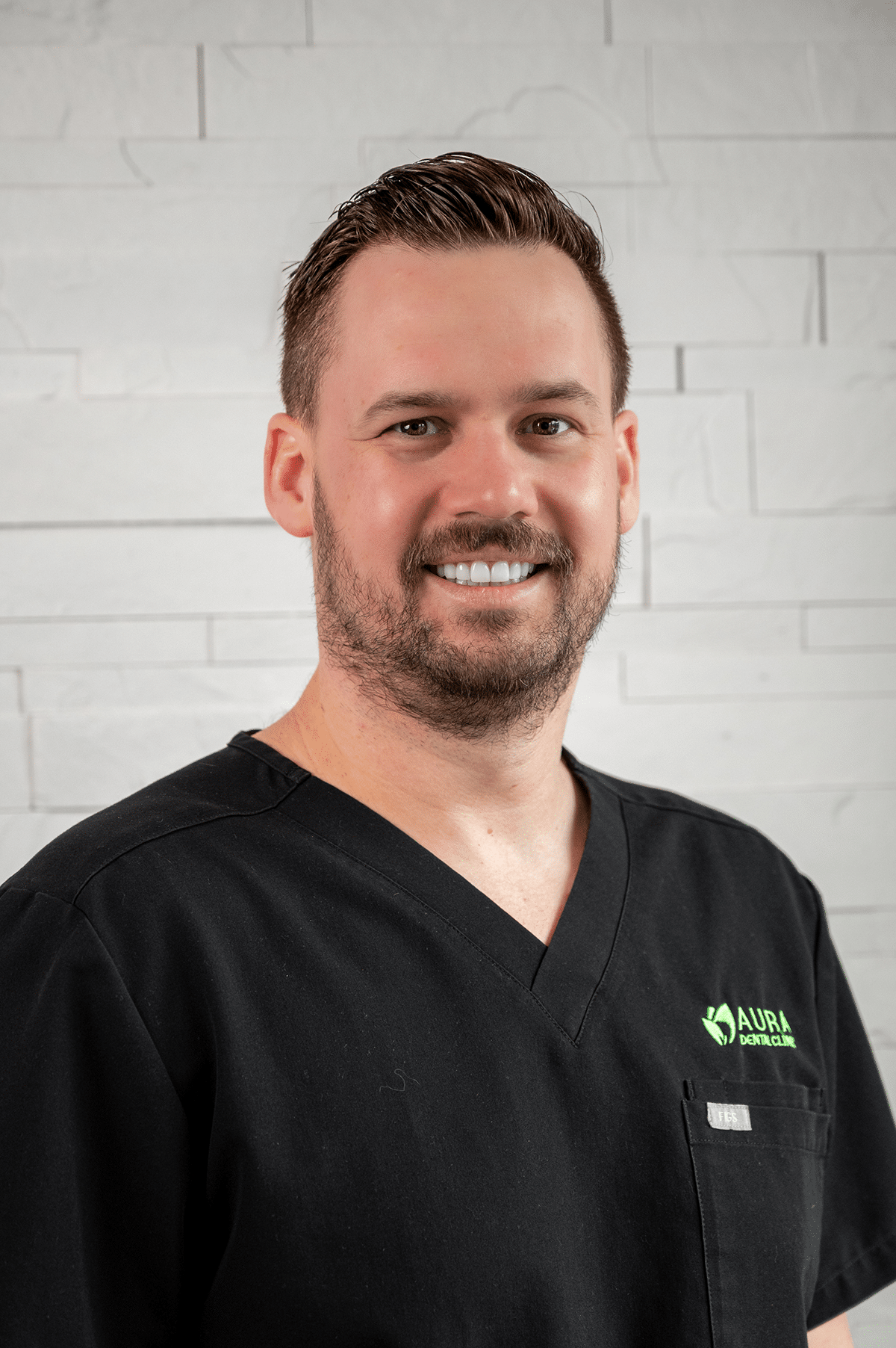 Dr Jesse smiling with Aura Dental Clinic